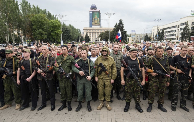 Image: Armed pro-Russian separatists of the self-proclaimed Donetsk People's Republic pledge an oath during a ceremony in the city of Donetsk