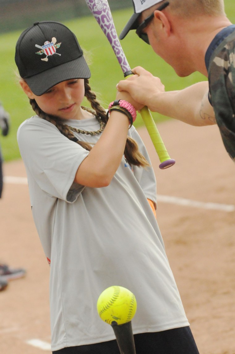 Jen Castro, 9, hits the ball.