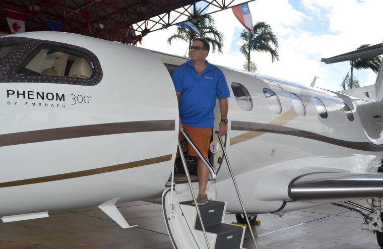 David Mendal, who owns several luxury travel companies, is shown next to his jet at the revamped Opa-locka Executive Airport.  An airport with a storied history, it had fallen into disrepair until the increasing numbers of wealthy Latin Americans and other entrepreneurs and jetsetters helped boost demand for the airport.