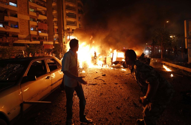 Image: The site of a car bomb attack in the mainly Shiite populated Shayyah neighborhood of a Beirut