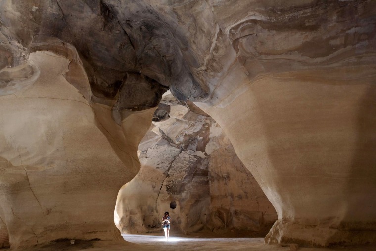 Image: Tourists visit the Bell caves locate at the Beit Guvrin-Maresha National Park in central Israel