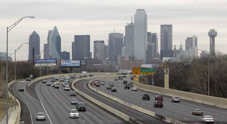 This Friday, Jan. 14, 2011 photo shows highway IH-30 traffic with the Dallas skyline in the background.
