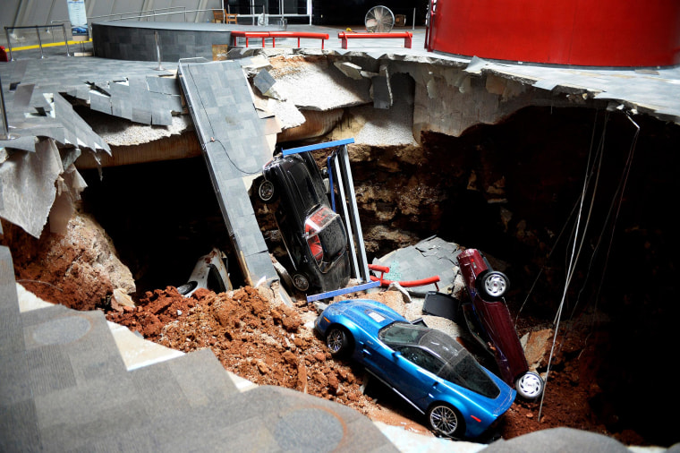 Image: A view of a sinkhole that opened up in the Skydome showroom on Feb. 12, at the National Corvette Museum in Bowling Green, Ky.