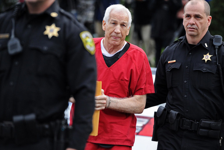 Image: Former Penn State assistant football coach Jerry Sandusky walks into the Centre County Courthouse before being sentenced in his child sex abuse case