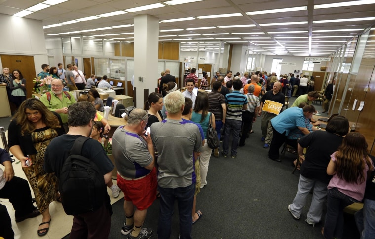 Image: Hundreds of same sex couples line up to apply for marriage licenses at the Marion County Clerks office in Indianapolis