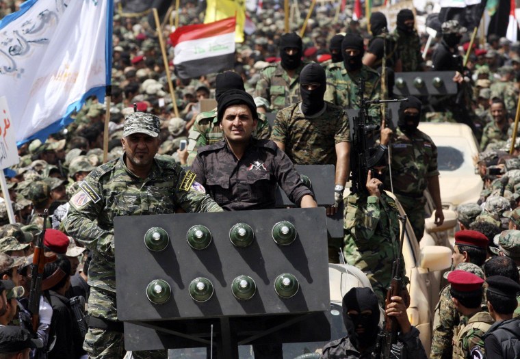 Image: Mahdi Army fighters during a parade in Baghdad on June 21