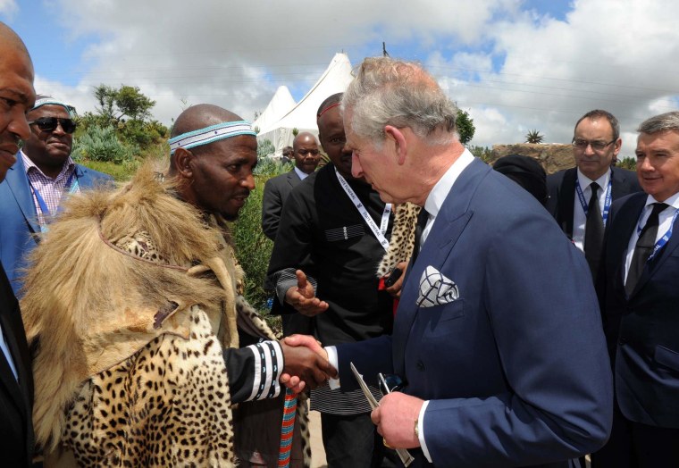 King of the Xhosa tribe Zwelonke Sigcau meets Britain's Prince Charles at Nelson Mandela's burial service, in Qunu, South Africa, Dec. 15, 2013.