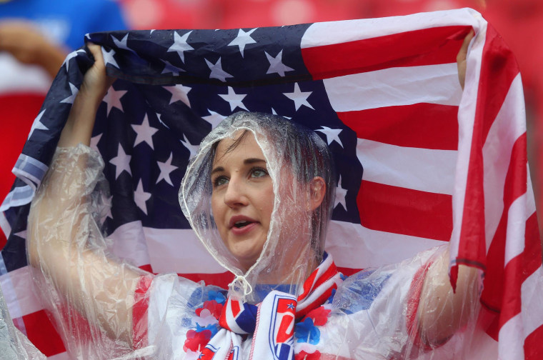 Image: A United States fan looks on in the rain prior to the 2014 FIFA World Cup Brazil group G match between the United States and Germany on Thursday in Recife, Brazil