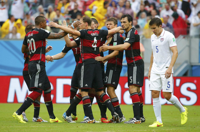 Image: Germany's Mueller celebrates after scoring a goal with teammates as Besler of the U.S. walks past during their 2014 World Cup Group G soccer match at the Pernambuco arena in Recife