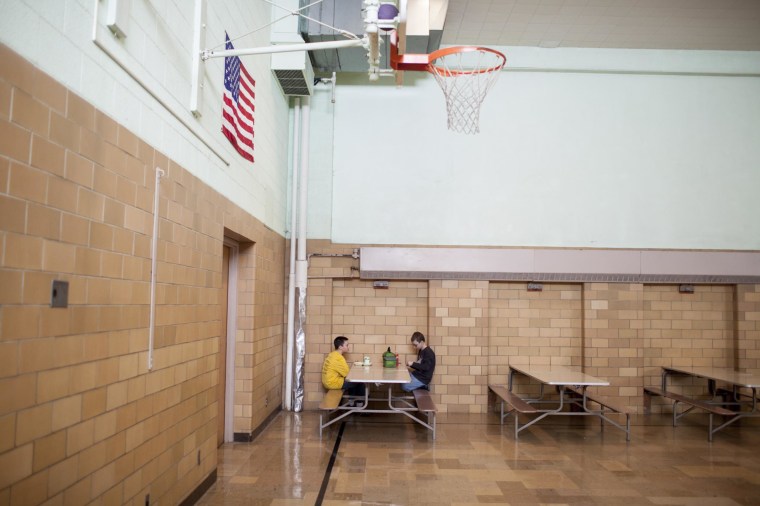 Image: Two students sit in the cafeteria of Cyrus' elementary school in Minnesota