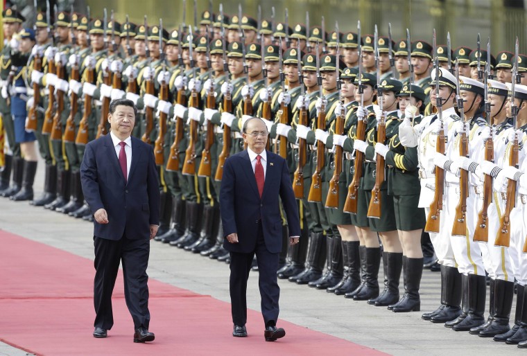 Image: Myanmar's President Thein Sein and China's President Xi inspect honour guards in Beijing