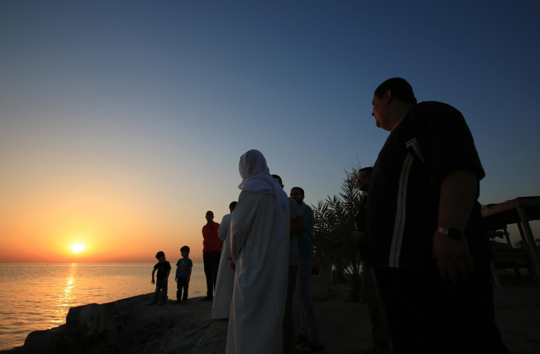 Image: Bahrainis look for the sliver of a new moon that would indicate the start of the Islamic holy month of Ramadan