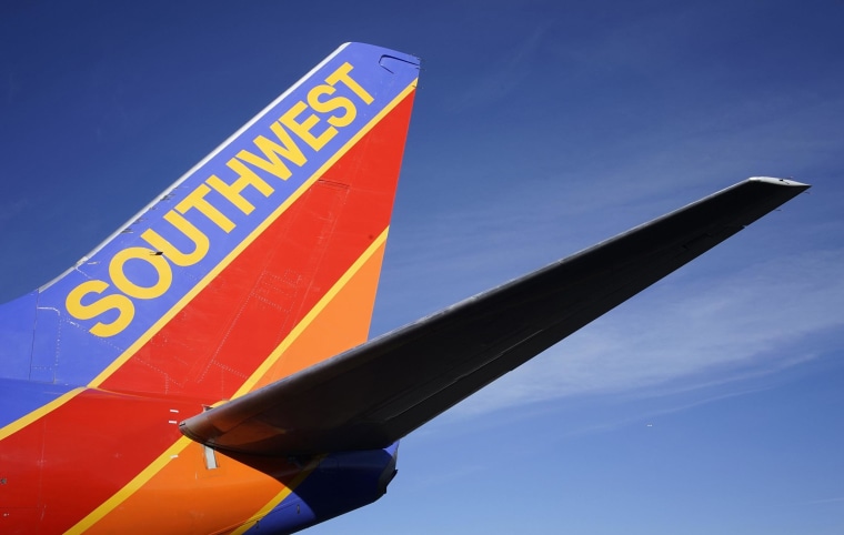 A Southwest Airlines jet waits on the tarmac Jan. 22, 2014, at Denver International Airport in Denver.