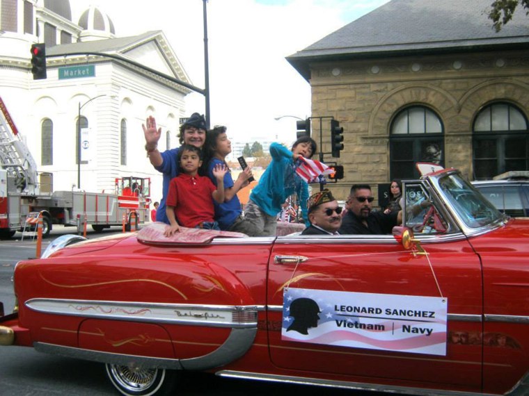 Image: Tiscareño-Sato and her children in a parade, Fall 2013.
