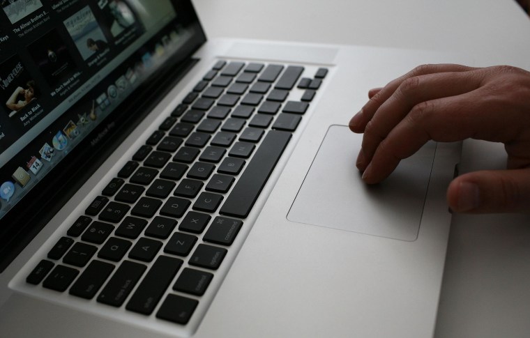 Image: A person uses a MacBook Pro laptop on Oct. 14, 2008 in Cupertino, Calif.
