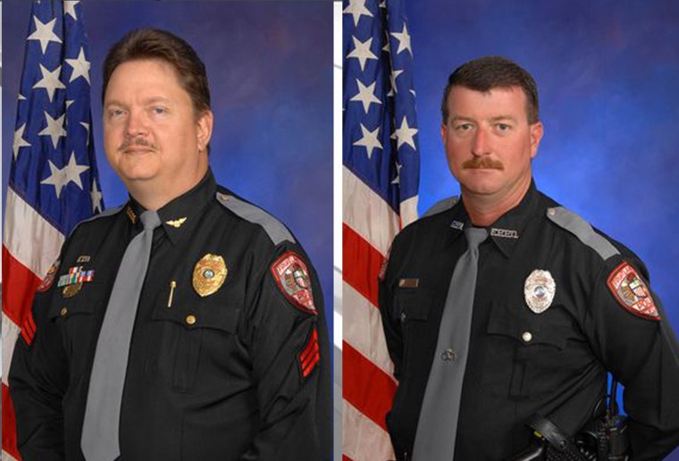 Image: A city official says two police officers in Florida, David Borst and George Hunnewell, are no longer with the department after a law enforcement report tied them to the Ku Klux Klan.