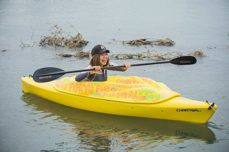 Image: Japanese artist Megumi Igarashi, known as Rokudenashiko, paddles in her kayak modeled on her vagina