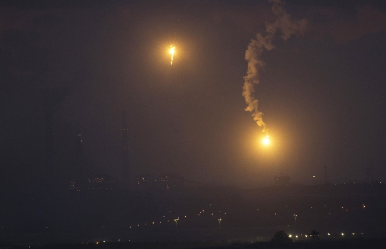 Image: Flares fired by the Israeli military are seen above the northern Gaza Strip, after a five-hour humanitarian truce