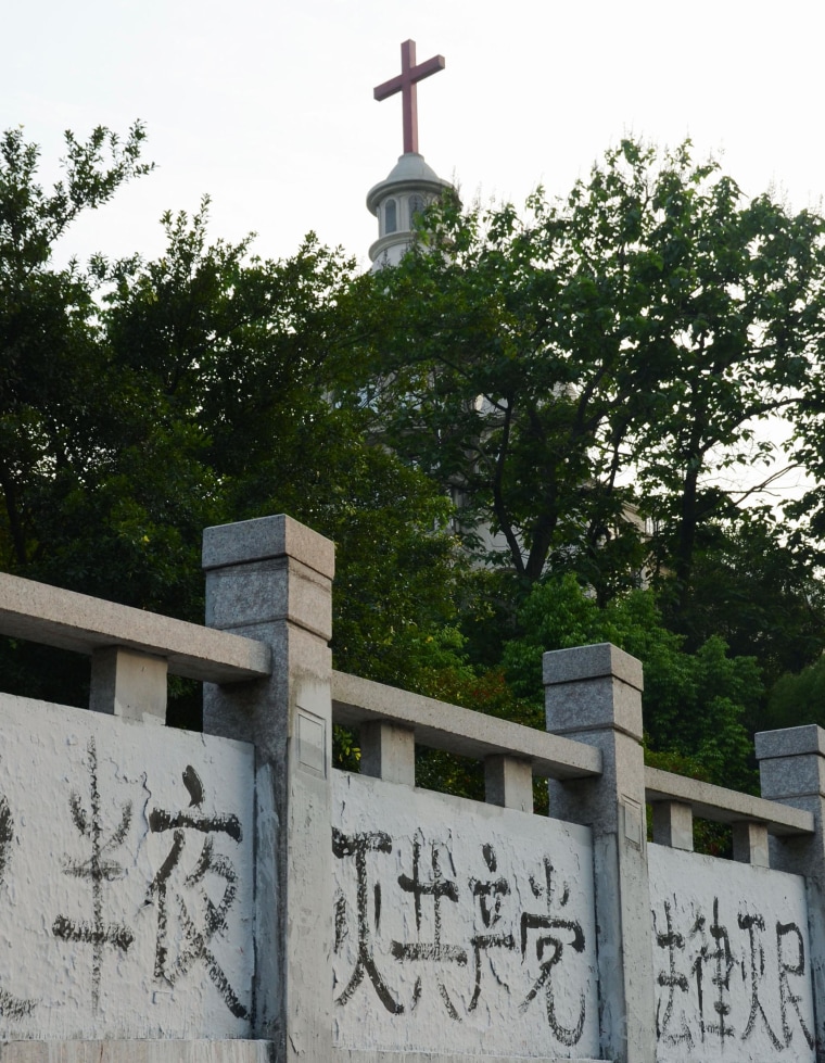 Image: Graffiti denouncing the Chinese Communist Party on a wall near a church in Wenzhou, Zhejiang Province, on April 28