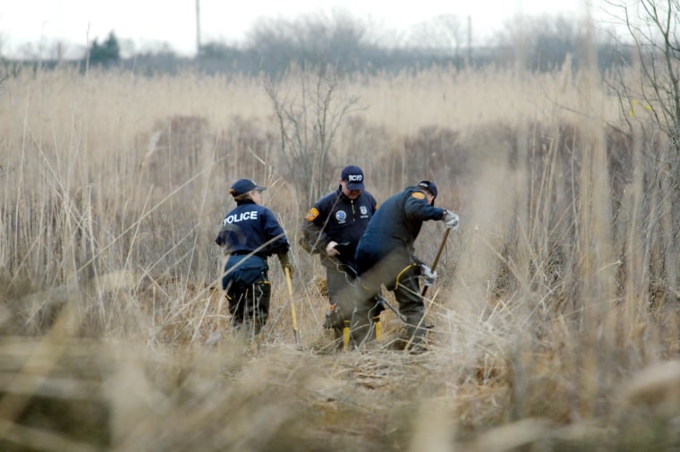 Image: Crime Scene investigators use metal detectors to search a marsh for the remains of Shannan Gilbert on Dec. 12, 2011 in Oak Beach, NY