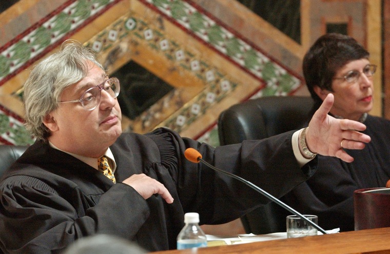 Image: Judge Alex Kozinski, of the 9th U.S. Circuit Court of Appeals, gestures as Chief Judge Mary Schroeder looks on in San Francisco on Sept. 22, 2003.