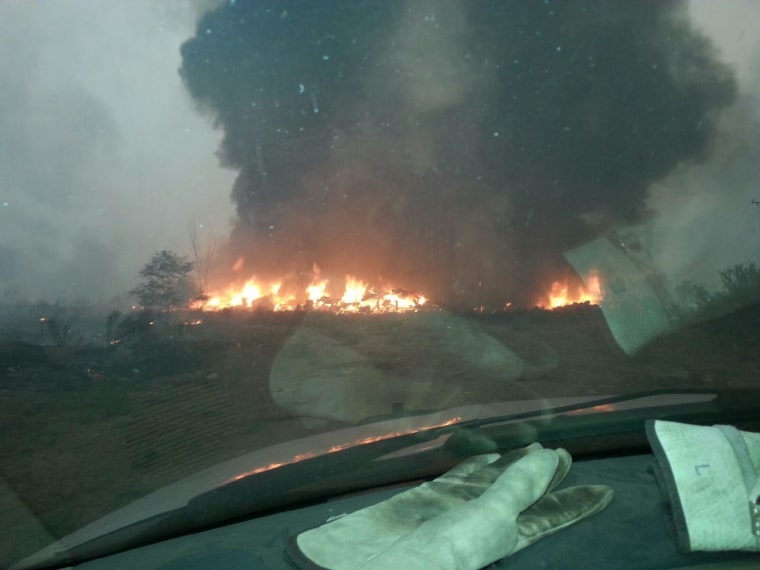 IMAGE: Washington's largest wildfire ever consumes the home of firefighter Justin Crump