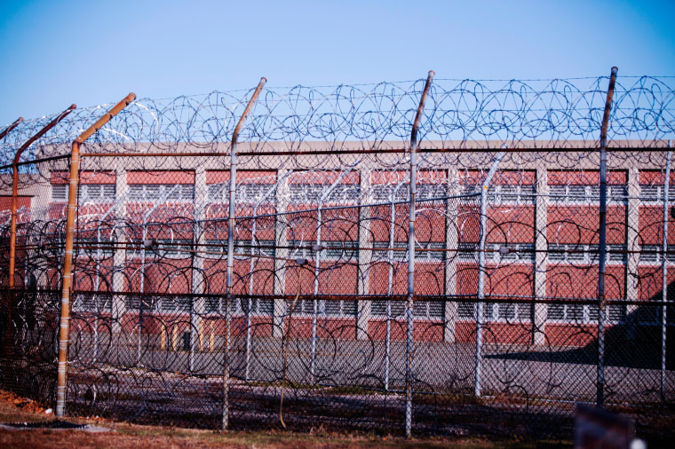 Barbed wire fences surround a building on Rikers Island Correctional Facility in New York