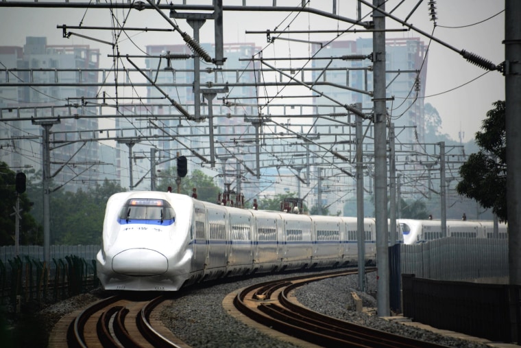 Image: A high-speed train travels on the railway to Beijing in Nanning, southern China's Guangxi province on June 13.