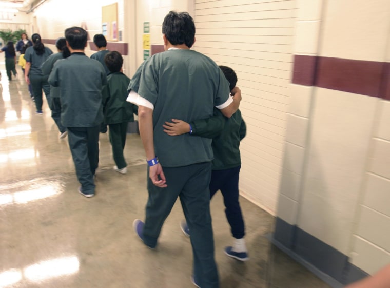 Image: Family detainees walking down the hall at the T. Don Hutto Residential Center in Taylor, Texas