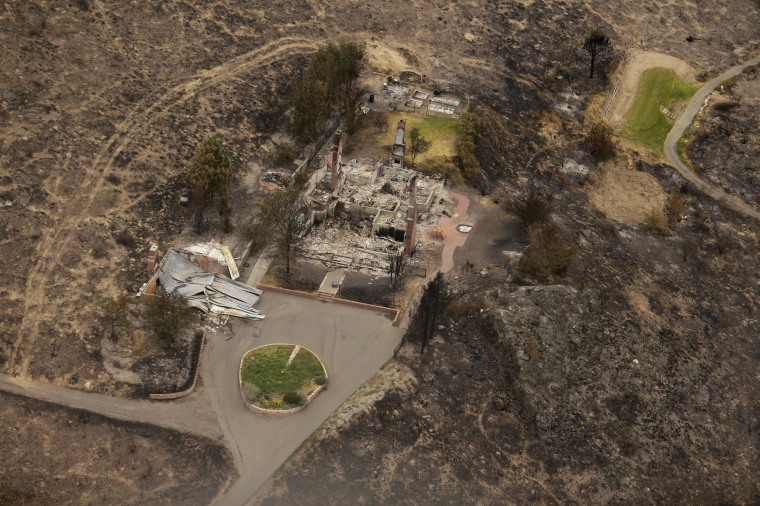 Image: Structures were destroyed by wildfires near Pateros, Wash.