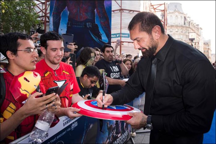 David Bautista signs autographs for fans at the UK Premiere of "Guardians of the Galaxy" in London.
