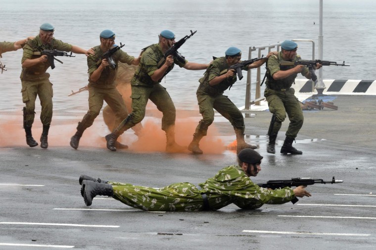 Image: Russian servicemen perform during a naval parade rehearsal in the far eastern port of Vladivostok