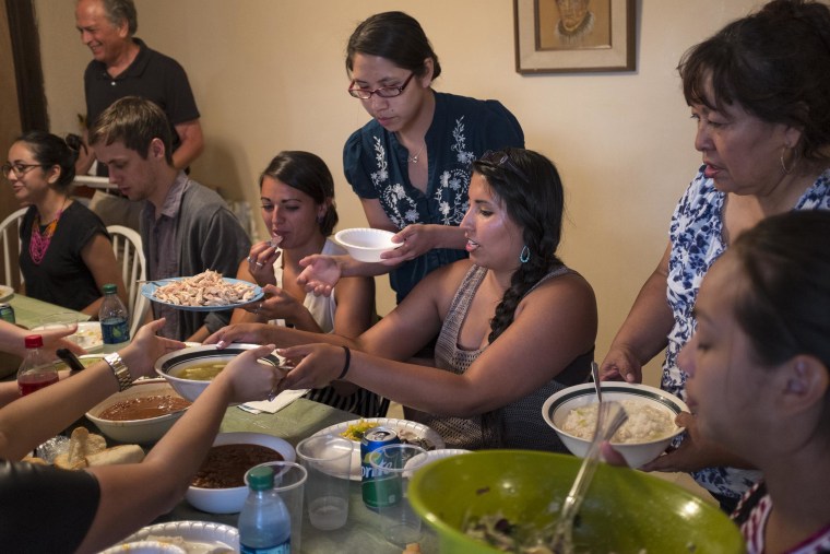Image: Danielle Lucero, center, hosts Columbia University mentors at a feast at her family's traditional home.
