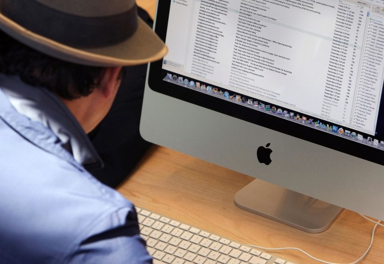 Image: A customer uses an Apple iMac computer