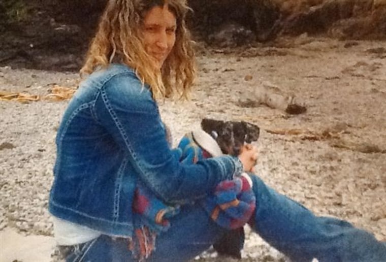 Image: Sandra Miller holds her dog on Glass Beach near Fort Bragg, Calif. in April 2013, a month before she was killed.