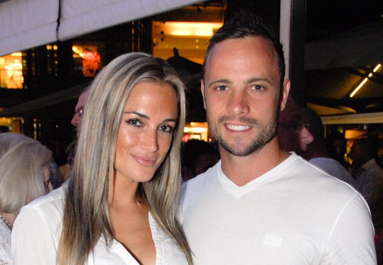 Olympian sprinter Oscar Pistorius posing next to his girlfriend  Reeva Steenkamp at Melrose Arch in Johannesburg. South Africa's Olympic sprinter Oscar "Blade Runner" Pistorius was taken into police custody on February 14, 2013, after allegedly shooting dead his model girlfriend having mistaken her for an intruder at his upscale home. 