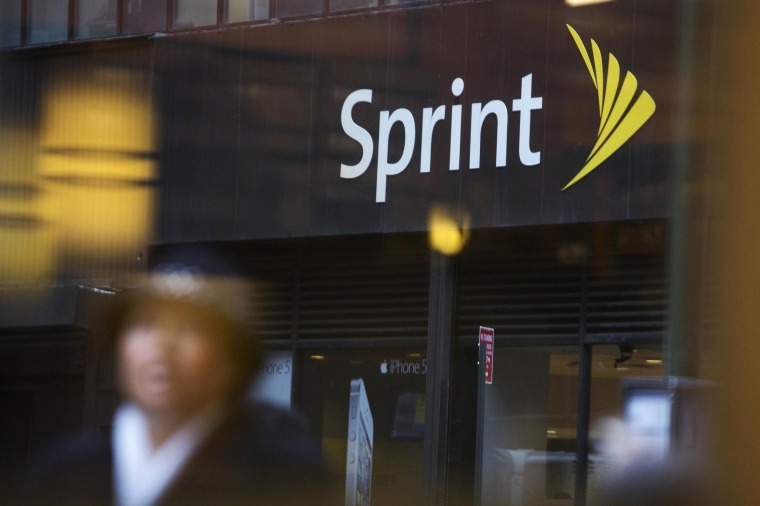 Image: File picture of people walking past a Sprint store in New York