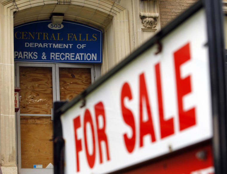 A "For Sale" sign is seen outside the boarded up entrance to the Central Falls Department of Parks and Recreation in Central Falls, Rhode Island August 1, 2011.  Central Falls, one of a handful of U.S. cities and counties facing fiscal collapse in the wake of the economic recession, filed for a rare Chapter 9 bankruptcy on Monday.    REUTERS/Brian Snyder    (UNITED STATES - Tags: BUSINESS)