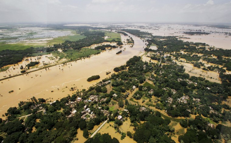 Image: An aerial view shows villages partially submerged by monsoon floods in Kendrapara district of eastern Orissa state, India