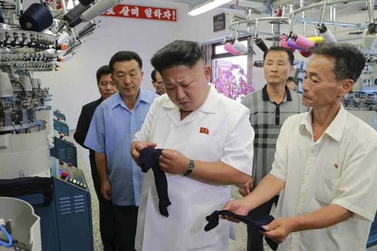 Image: North Korean leader Kim Jong-un visits a hosiery factory