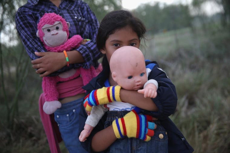 Image: Salvadorian immigrant Stefany Marjorie, 8, holds her doll Rodrigo after crossing the Rio Grande from Mexico into the United States