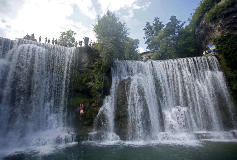 A competitor takes part in the first international waterfall jumping competition held in the old town of Jajce, Bosnia and Herzegovina, on August 9.