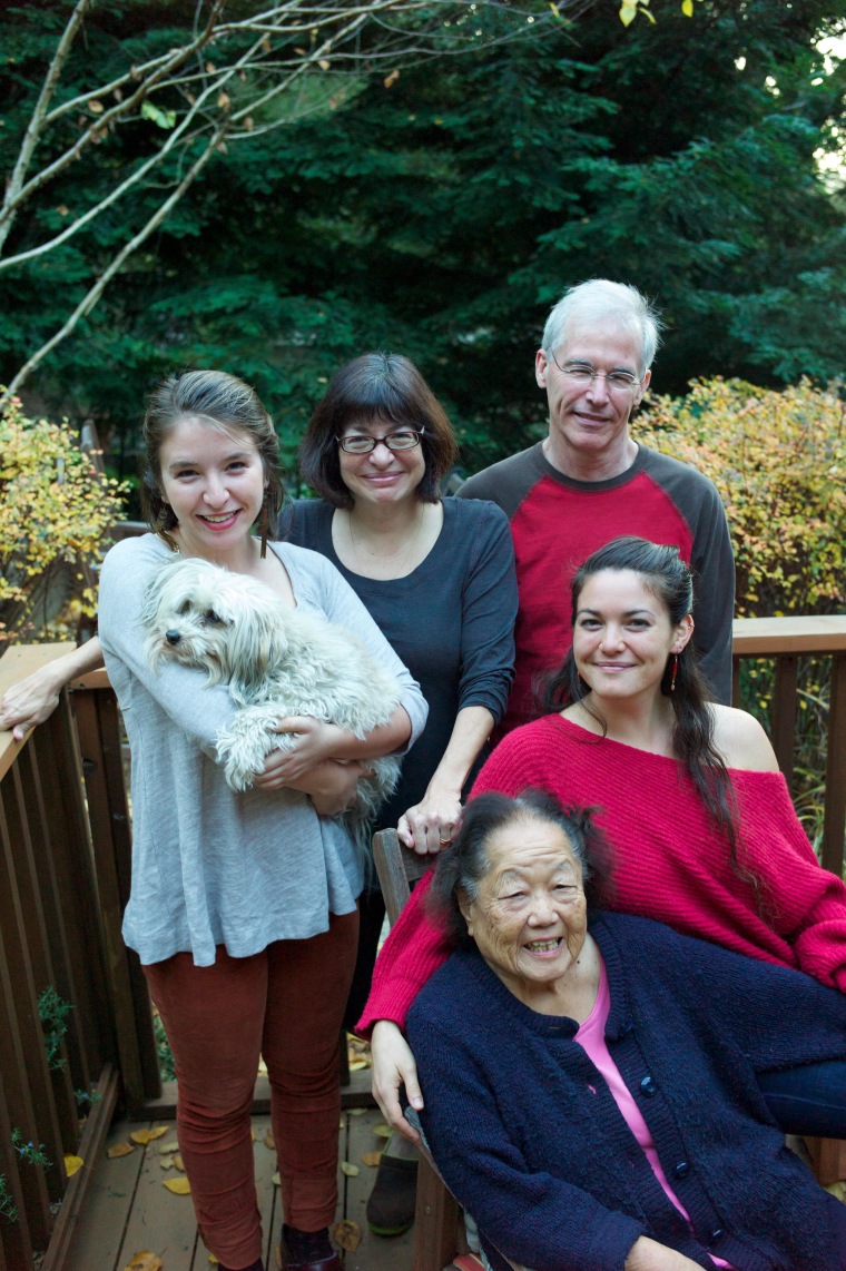 Susan Ito, husband John Roark, daughters Emma and Mollie, and Kiku at their home in Oakland.