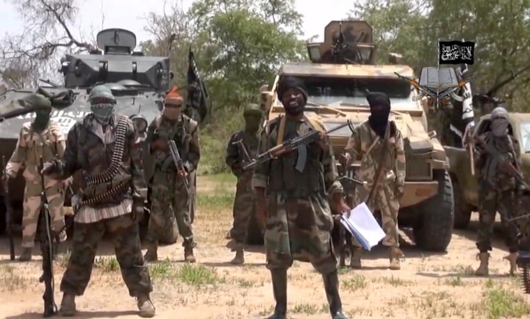 Image:A screengrab taken on July 13, 2014 from a video released by the Nigerian Islamist extremist group Boko Haram and obtained by AFP shows the leader of the Nigerian Islamist extremist group Boko Haram, Abubakar Shekau (C), referring to the Bring Back 