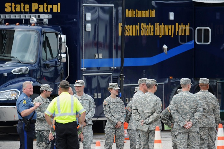 Initial personnel from the Missouri National Guard arrive at the Missouri Highway Patrol command center at the Plaza Boulevard Shopping Center in Ferguson, Missouri on Aug. 18, 2014. 