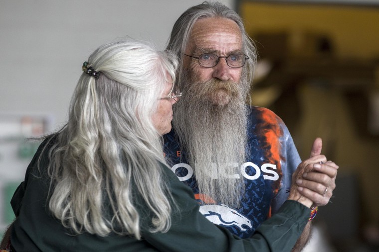 IMAGE: Richard Craig dances with his wife, Sherry, at the 75th anniversary picnic for the local power plant in Nucla, Colo.