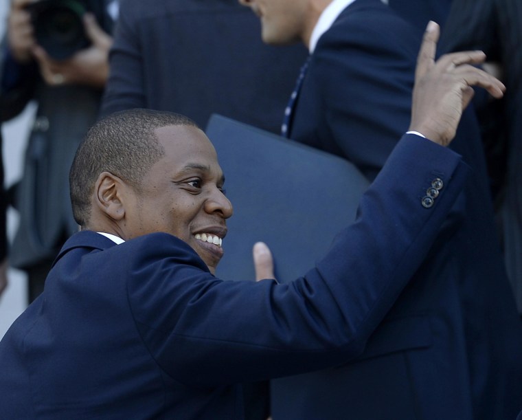 Image: Rapper Jay-Z acknowledges a fan during a news conference after announcing his two-day "Made in America" music festival with Los Angeles Mayor Eric Garcetti, in Los Angeles