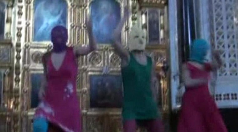 Image: Still image taken from file video shows members of the female punk band "Pussy Riot" staging a protest inside Christ The Saviour Cathedral in Moscow