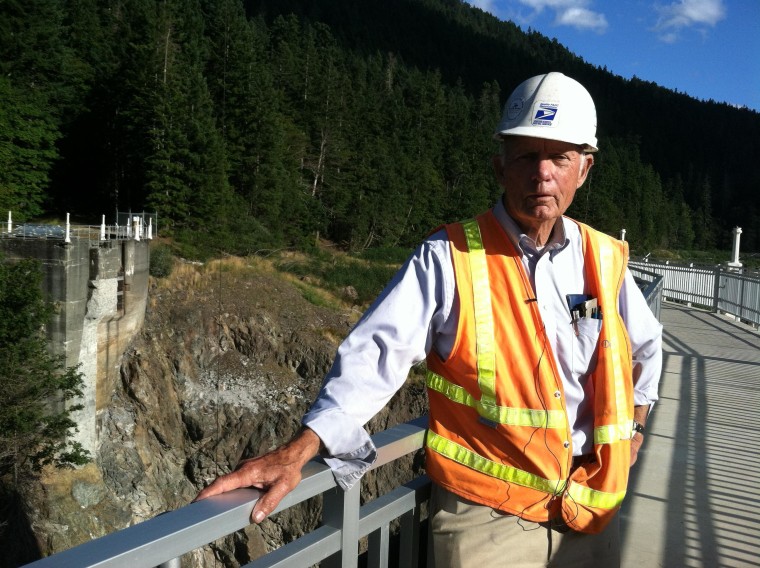 Image: Construction manager Don Laford stands on what remains of the Glines Canyon Dam.