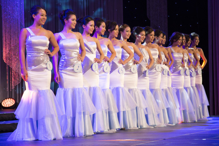 Contestants at the Miss NY Chinese Beauty Pageant 2014 gather on stage for the announcement of the overall winner along with other prizes for congeniality, fitness and photogenic appeal. 